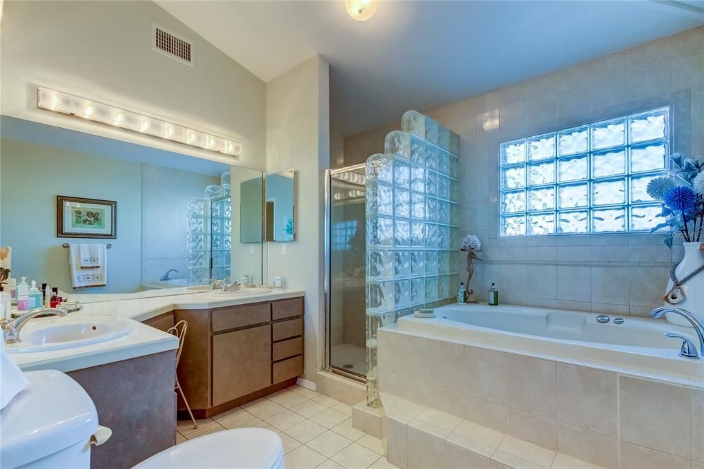 Primary bathroom is luxurious with Garden tub, walk-in shower, dual sinks and a make up vanity.