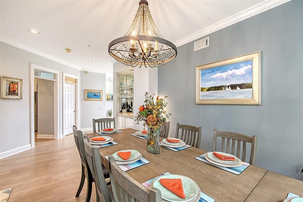 Dining area, adjacent bar and half bath in background.