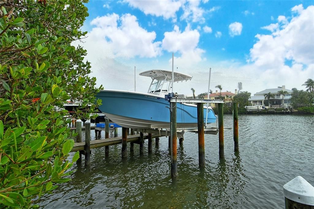 Deeded dock with electric, and water, 13,500 LB lift on deep water.