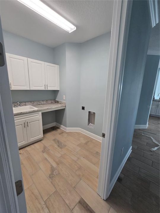 Laundry room in condo