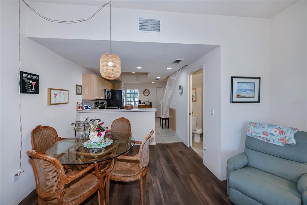 separate dining area with decorator lighting