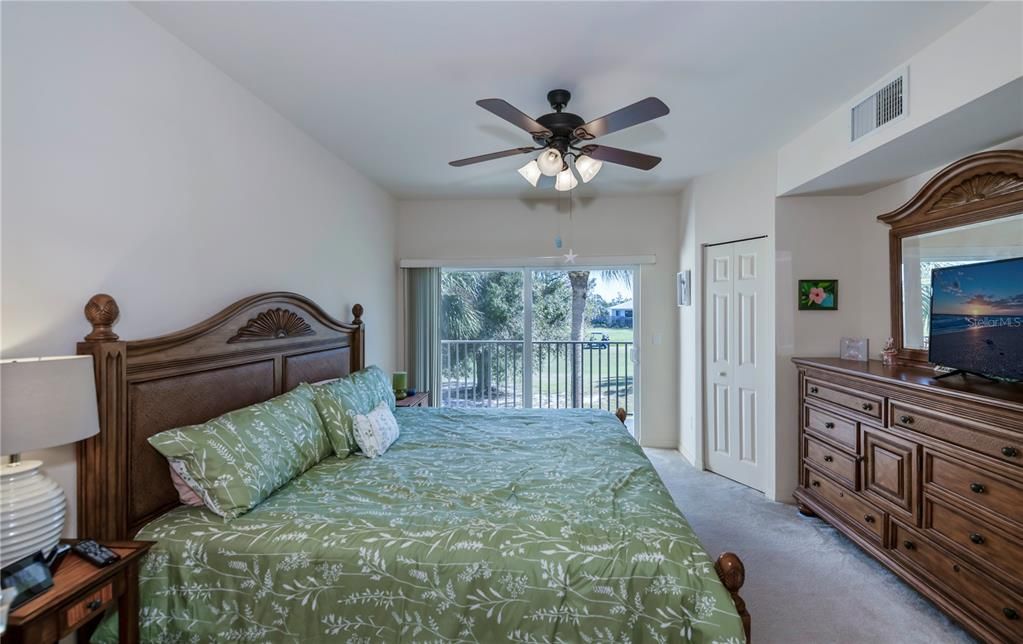 spacious master suite is lovely with its own private  balcony