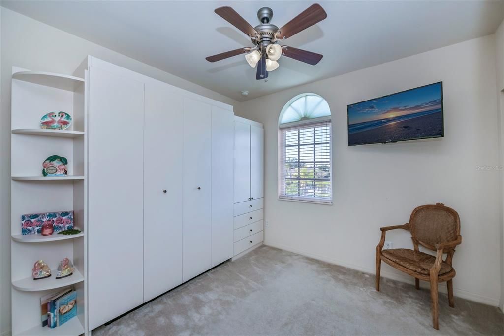 spacious guest bedroom has lots of beautiful storage area too