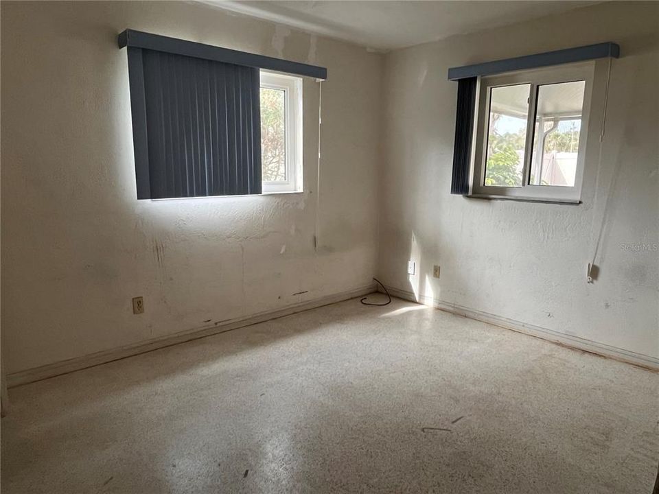 Bedroom 2 with terrazzo floors