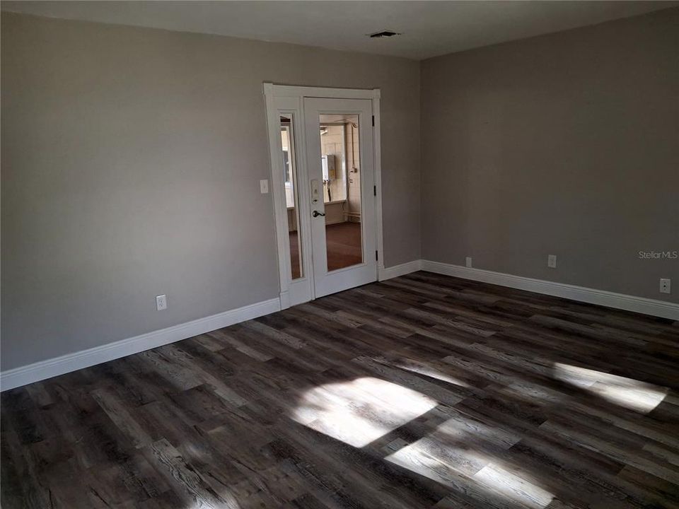 Back door in Living area exits to the screened patio