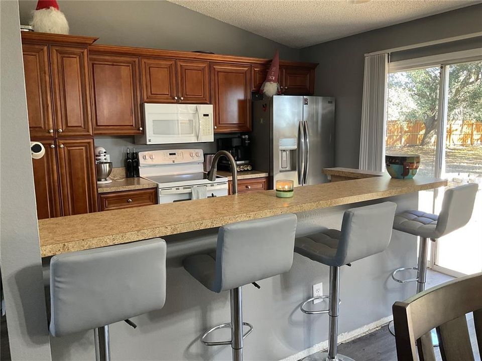 Kitchen with bar top seating