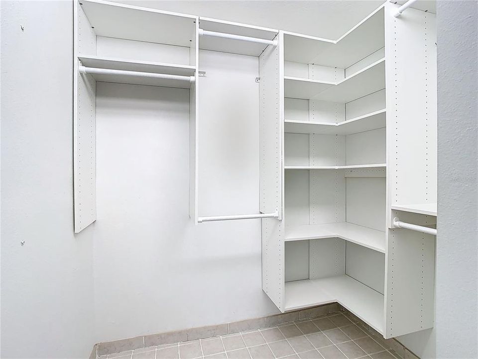 Primary bedroom walk-in closet