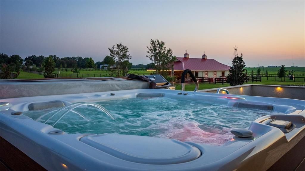 Relax in your spa overlooking the property