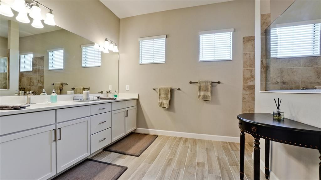 Primary Bathroom with Dual Vanities and Zero Entry Walk-in Shower