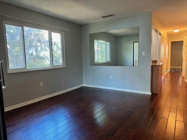 Living Rm with Wall Mirror reflects View fm Windows