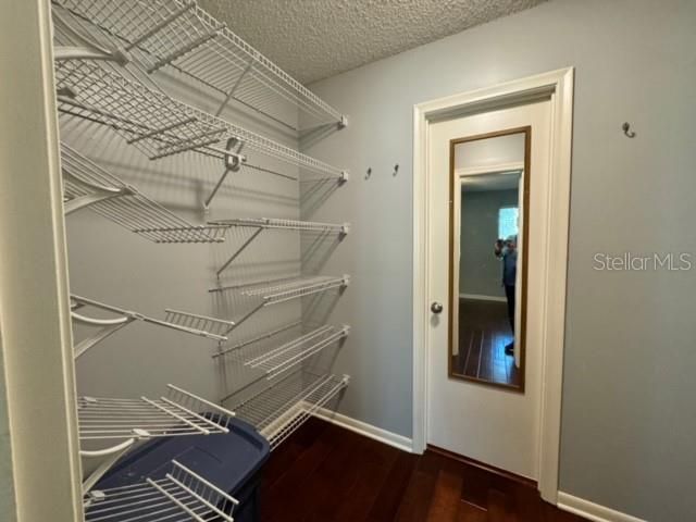 Spacious walk-in-closet between bedrm & bath