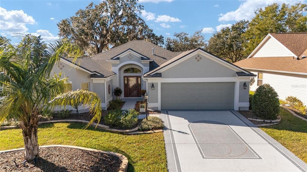 The epoxy driveway creates an inviting entry to the home