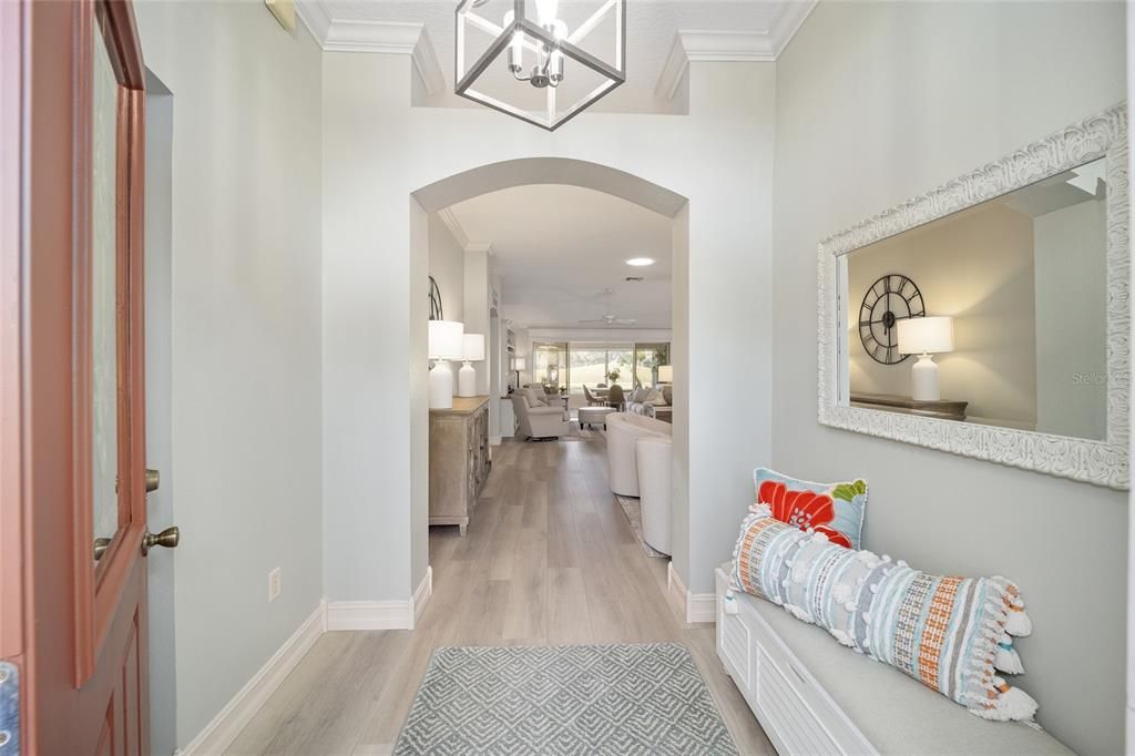 The welcoming view when you enter the front door.  You can see straight through to the golf course behind the home.