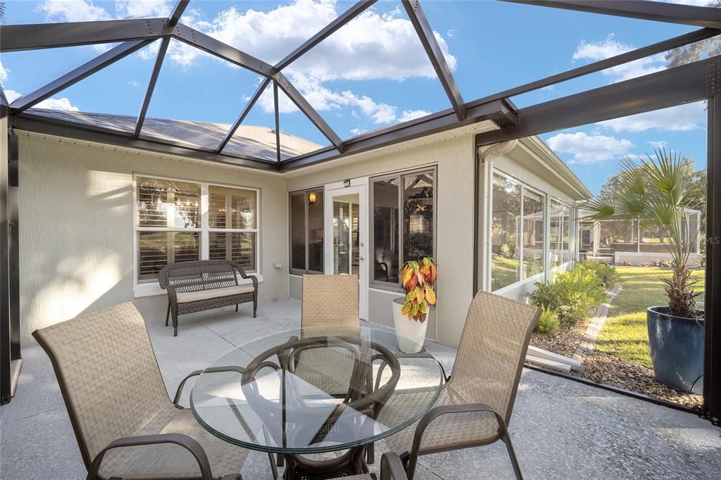 The lanai is blended into the home through the flooring and paint