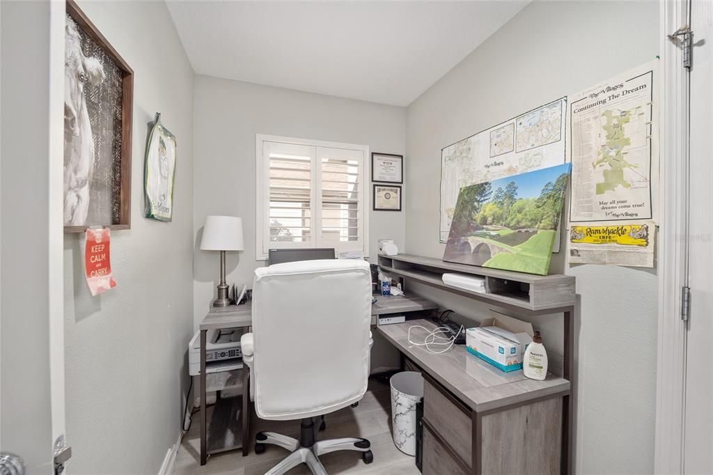 The end of this laundry room has been set up as an office.