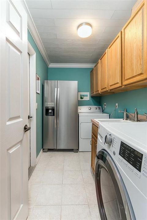 laundry with cabinets, second frig,sink