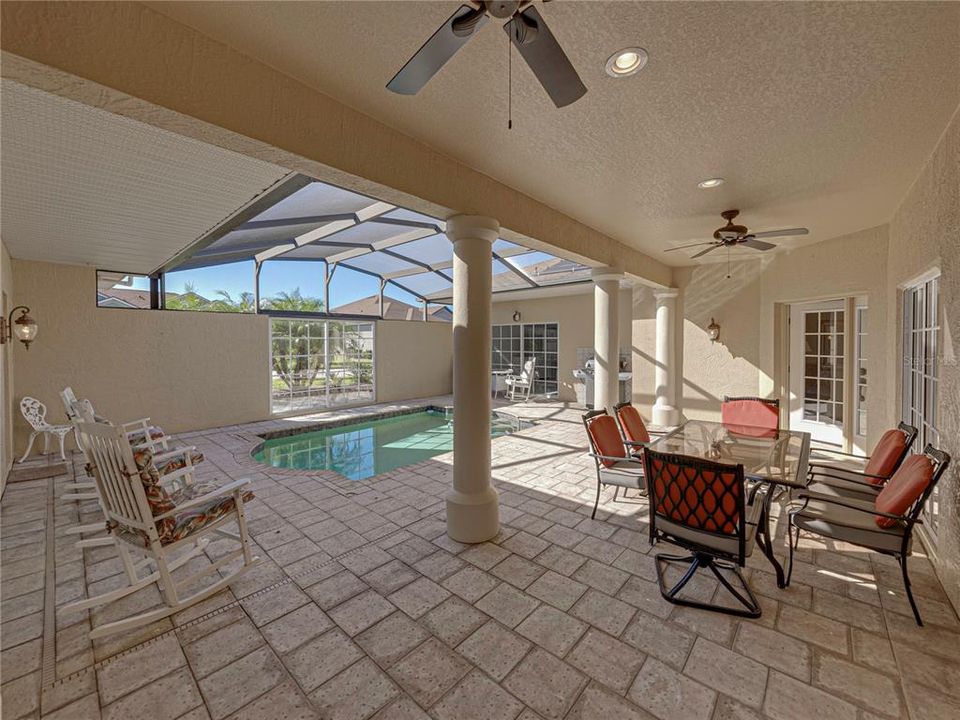 Large pool lanai area half covered half screened