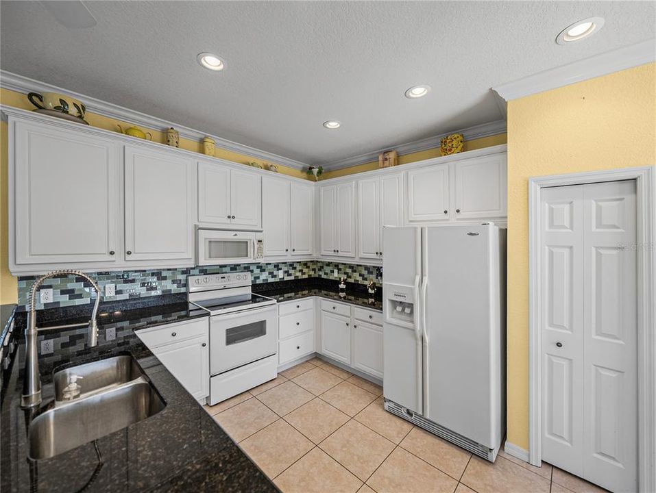 Plenty of kitchen cabinets for storage along with pantry