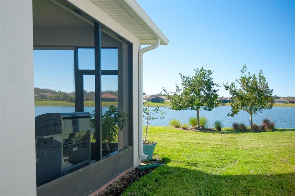 Fully screened extended lanai with a full view of the pond