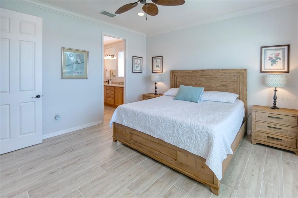 Throughout the home, there's a soft hint of color on the walls, again crown molding, rounded corners....and NO CARPET! Tile throughout!