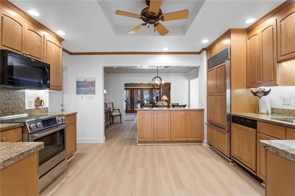 Kitchen view of Dining and Family Rooms