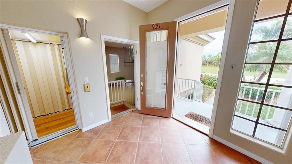 First floor foyer - Garage access, Stairwell & elevator to living floor