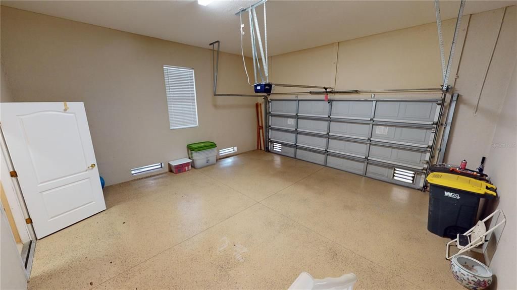 Two-car garage with elevator to 1st floor foyer and living floor