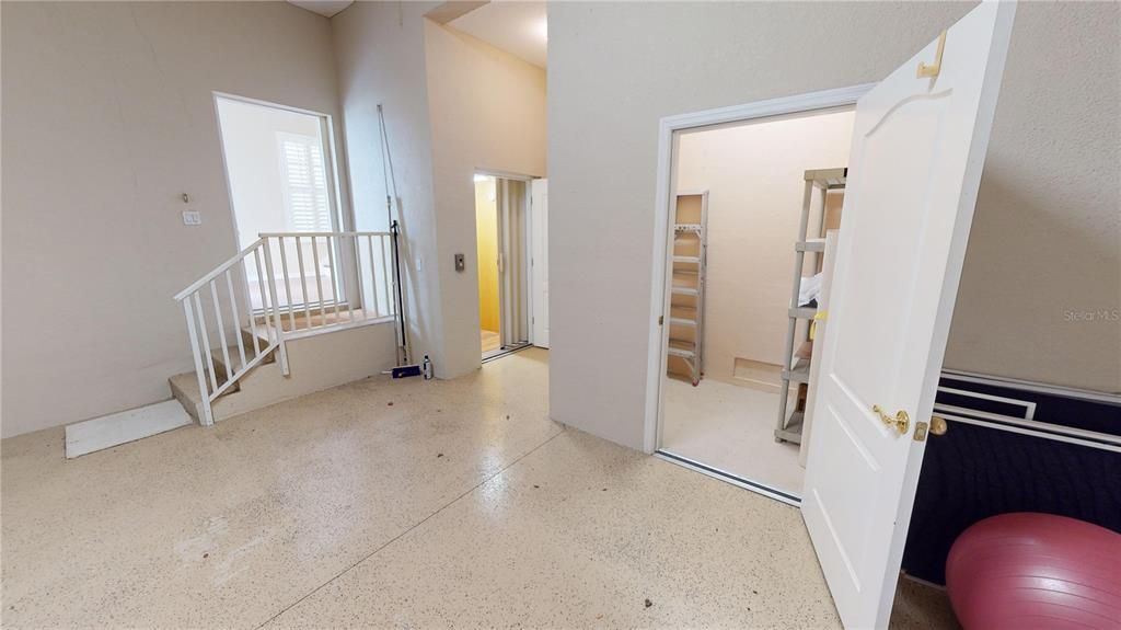 Two-car garage with elevator to 1st floor foyer and living floor