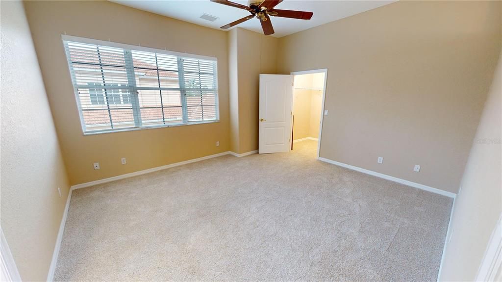 Guest bedroom with walk-in closet