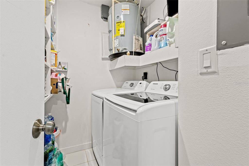 This beautiful villa has a laundry room with a washer and dryer, and plenty of built-in shelves for storing cleaning supplies and essential.