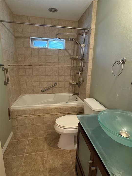 Guest bath with Jacuzzi tub.  Needs repair