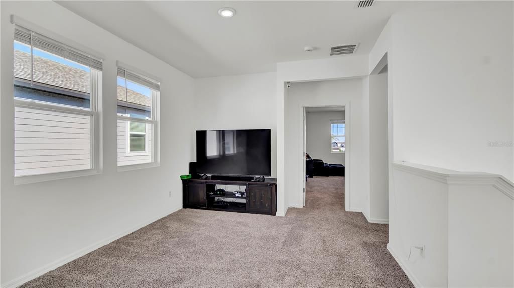 Loft Space showing master bedroom to the back