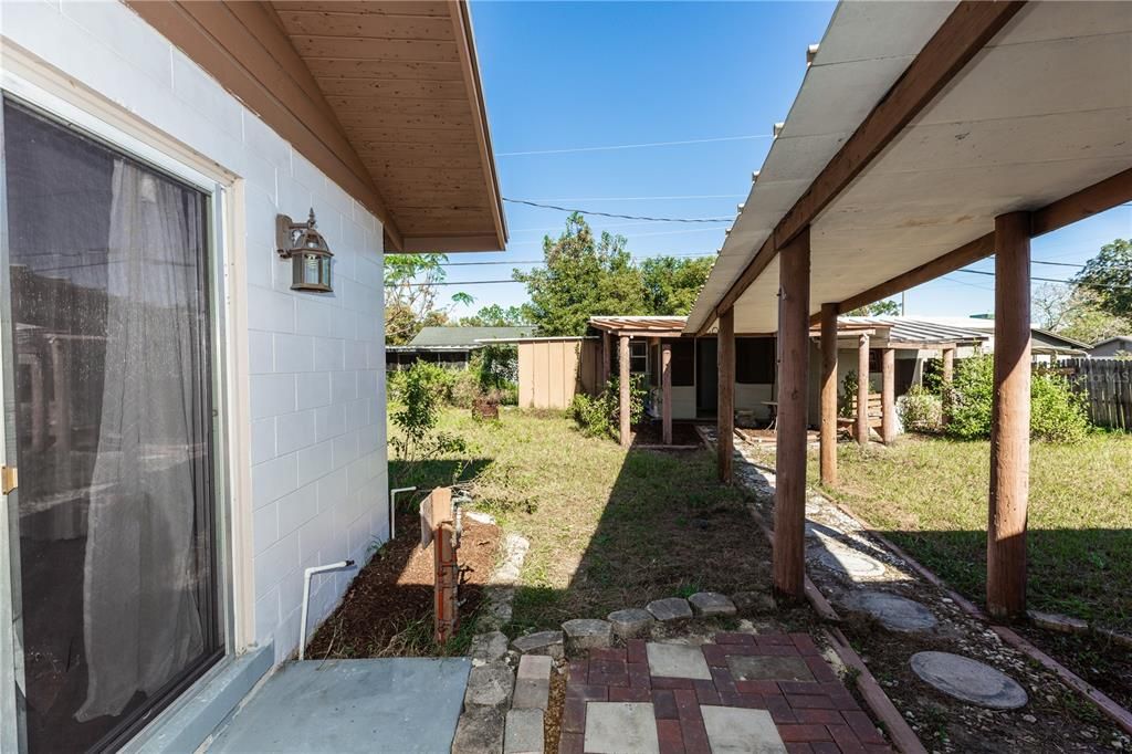 COVERED WALKWAY TO STORAGE BUILDING