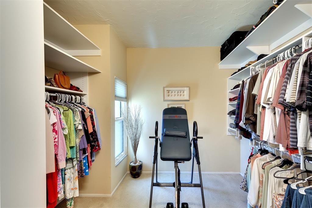 Large walk-in closet in primary bedroom.