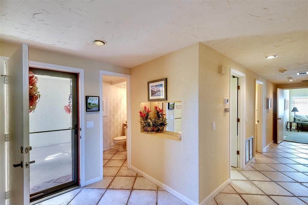 Front entryway and powder room for guests.