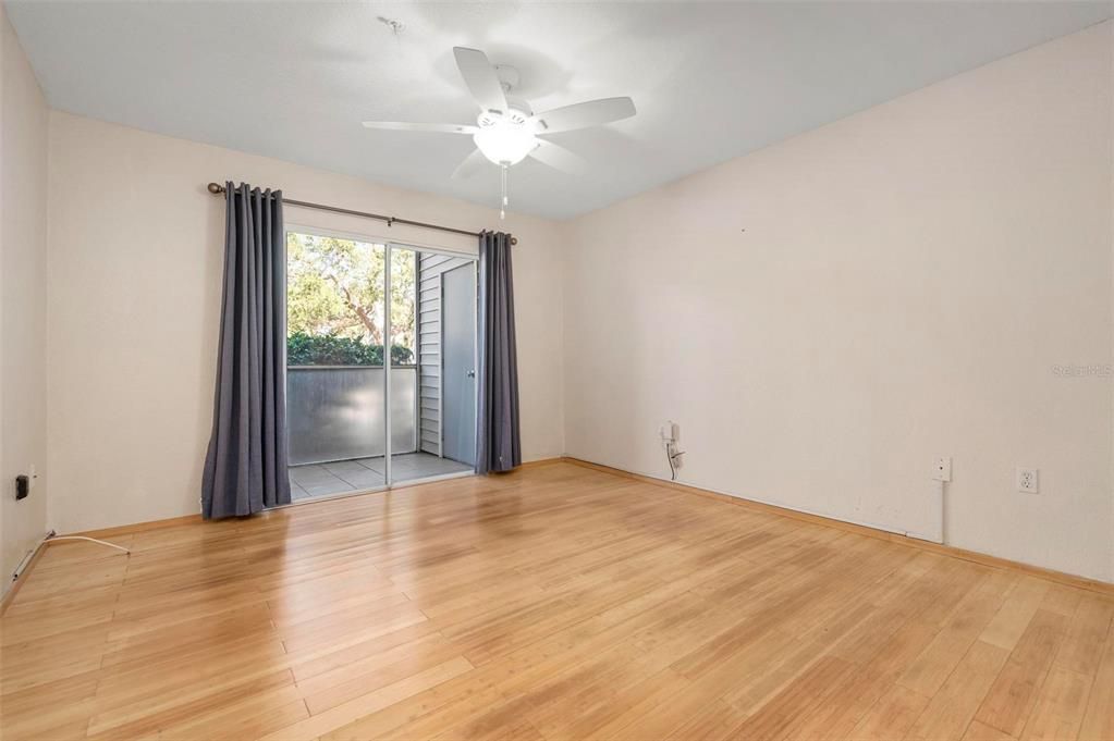 Primary bedroom with a lanai and storage room