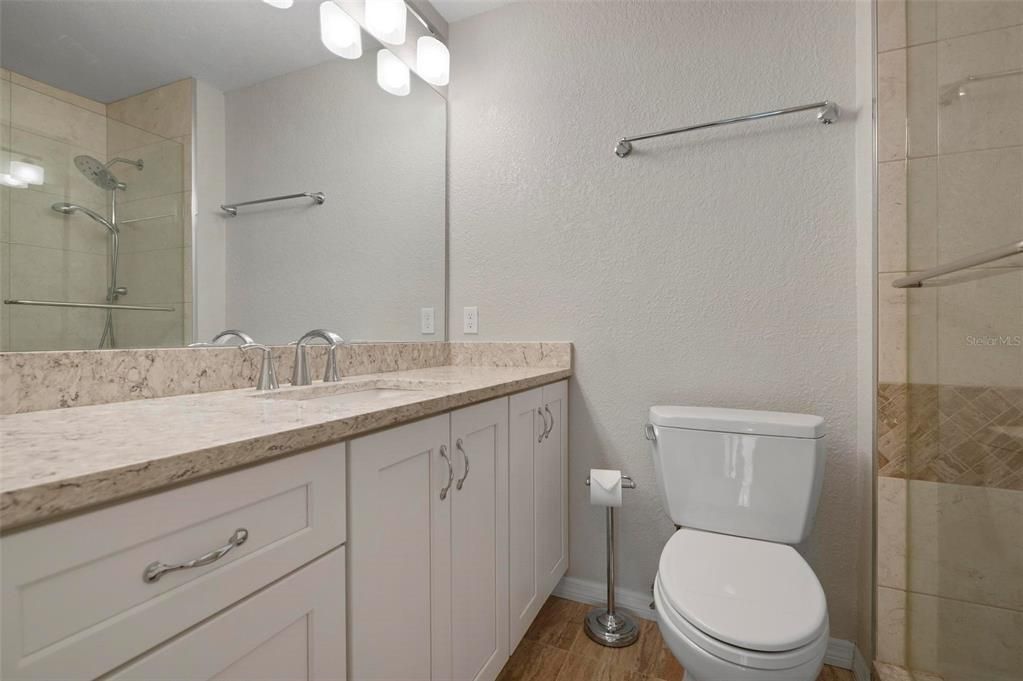 Updated primary bathroom with walk in shower