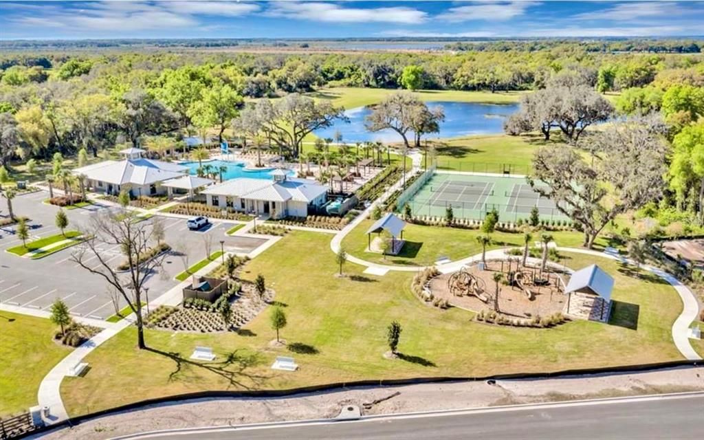 Resort-style swimming pool, clubhouse with a fitness center, and tennis and pickle ball courts along with walking trails throughout the community