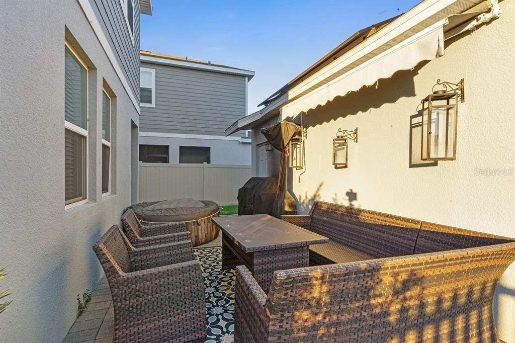 Back porch with awning and  detached rear load garage.