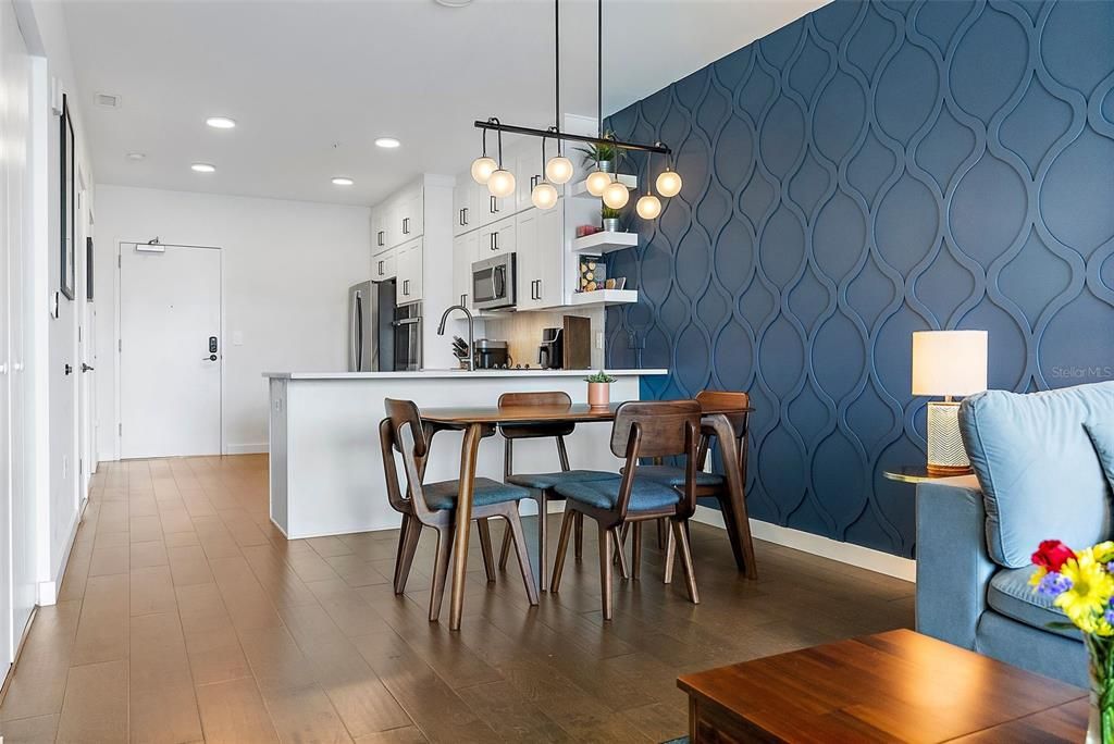 The dining Room features a brand new chandelier, contemporary in design