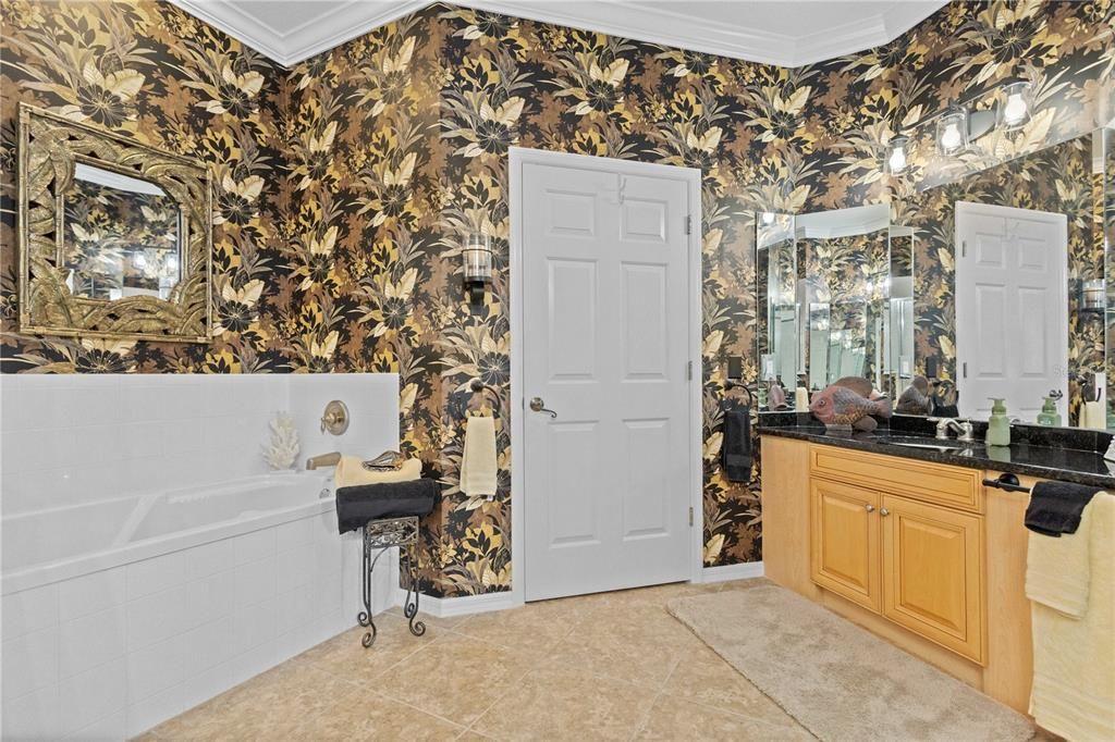 Master bath with his and her sinks and water closet.