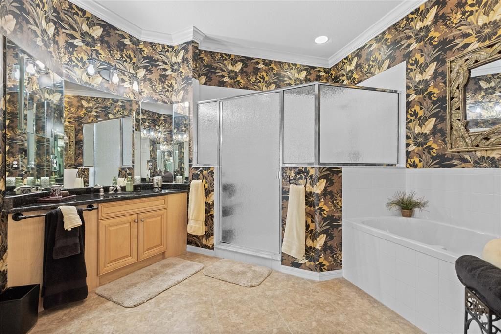 Superior and elegant master bath with walk-in shower and tub.