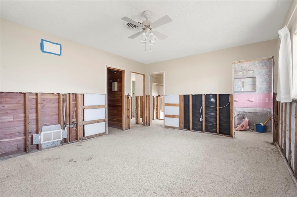 Primary bedroom with bathroom and walk in cedar lined closet