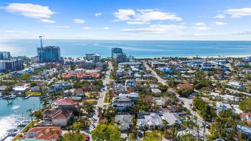 Follow road in front of the house directly to Lido Key public access to the beach - next to tallest building on the right