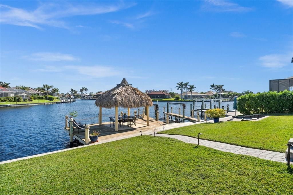 Looking from the Yard toward the Tiki Hut and the Canal Beyond