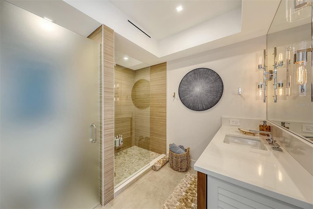 The frosted glass encloses the water closet