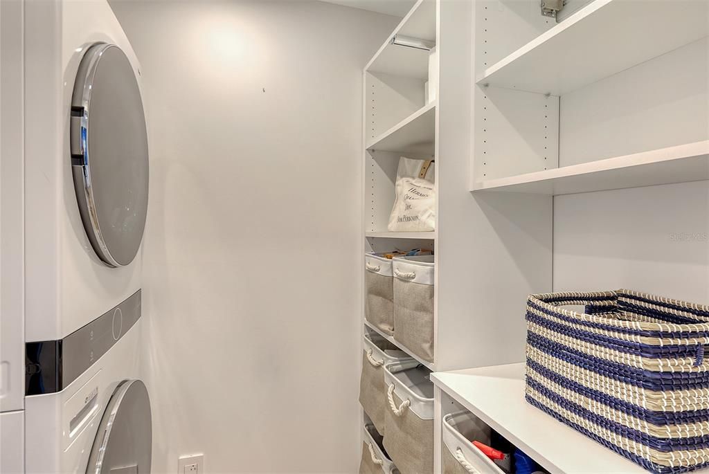 A sleek but functioal laundry room w/ great storage