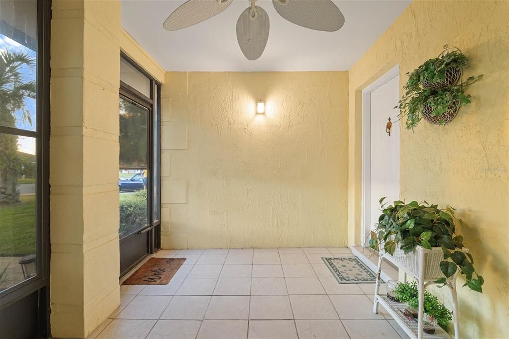 tiled screened-in front patio