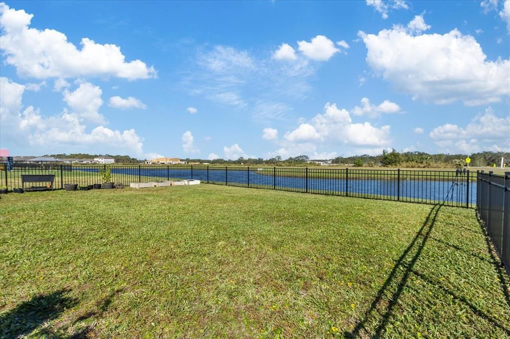 Fenced Back Yard overlooking the Pond