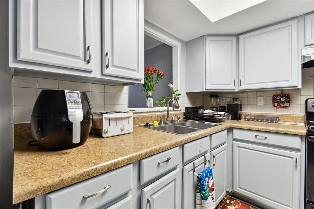 Lots of cabinetry in this open Kitchen.